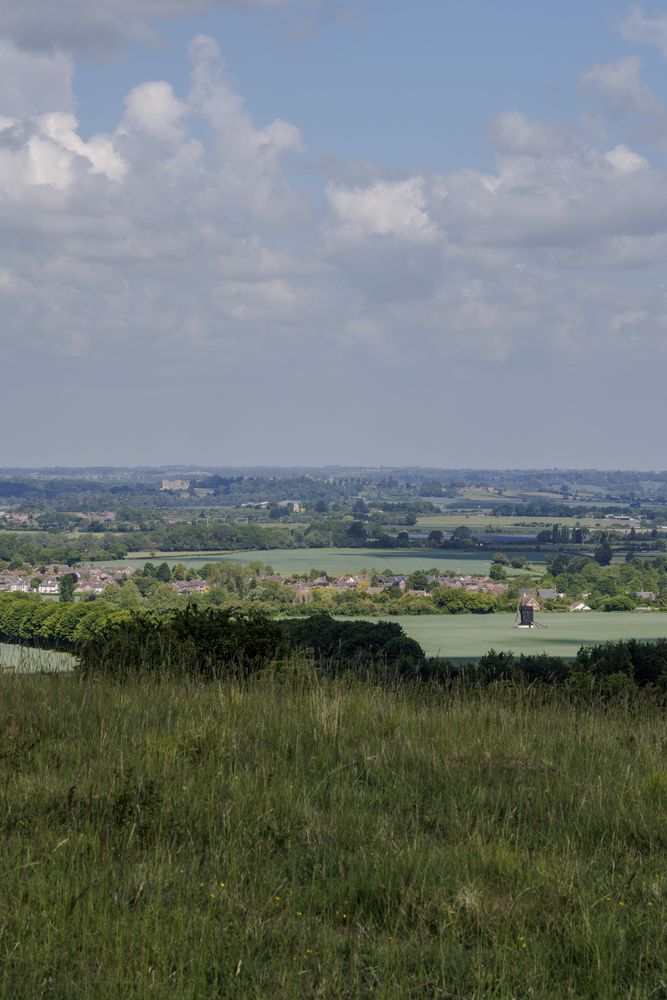 Looking down from Pitstone Hill looking down towards the Pitstone Windmill, the village of Pitstone, and Mentmore Towers in the distance.